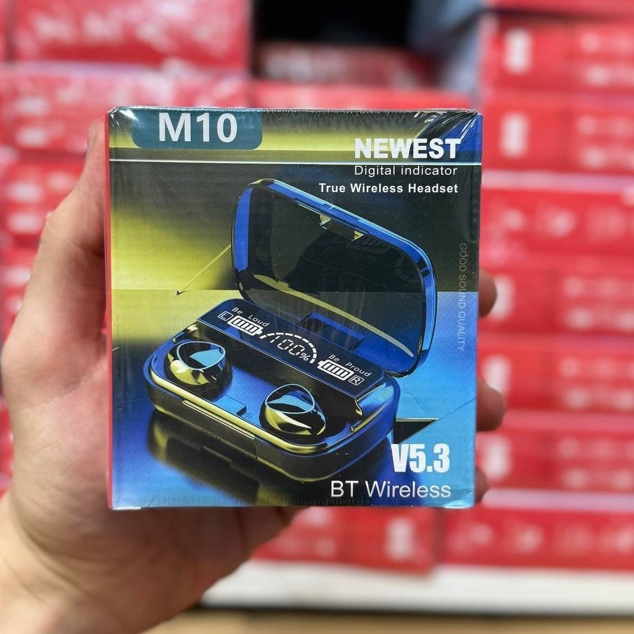 Hand holding a box of M10 wireless headset with red stacked boxes in the background
