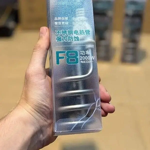 Hand holding a packaged product labeled 'F8' with text in a foreign language on a blurred background