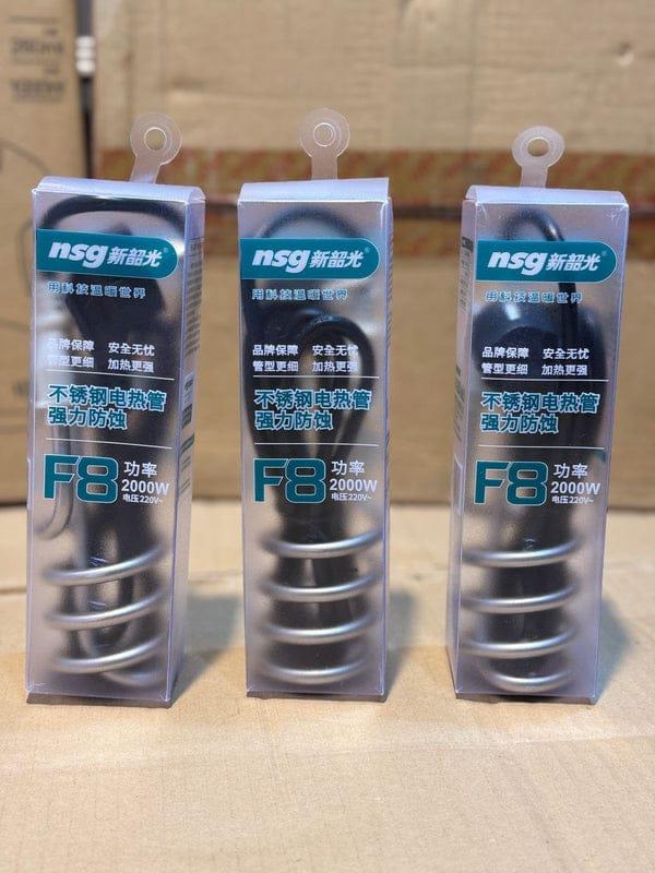 Three nsg branded electric heaters in packaging on a cardboard background